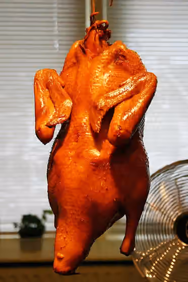 Masakan Beijing — Peking Duck, being dried for 5 hours.
