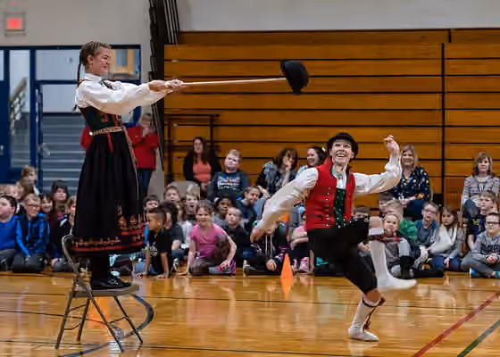 Halling (dance) — A member of the Stoughton High School Norwegian Dancers performs the hallingkast--"hat kick" at a Wisconsin elementary school.