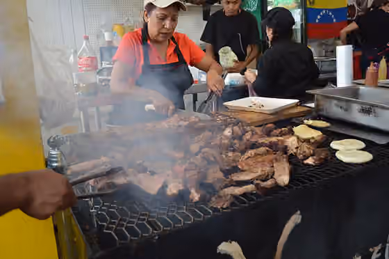 Venezuelan Mexicans — Grilling various meats at the Venezuelan stand at the Feria de la Torta at the Venustiano Carranza borough hall in Mexico City