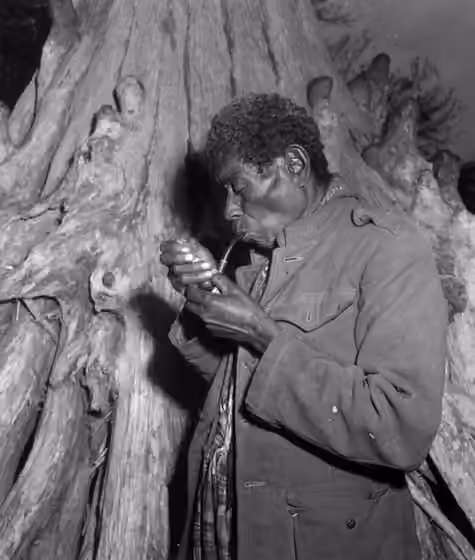 Black Seminoles — Local call number: c017188 Title: [Aged black Seminole smokes from his pipe : Everglades, Florida] Date: 1952.