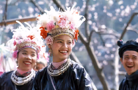suku Kam — Ethnic Dong women and man in holiday dresses, Liping County, Guizhou Province, China