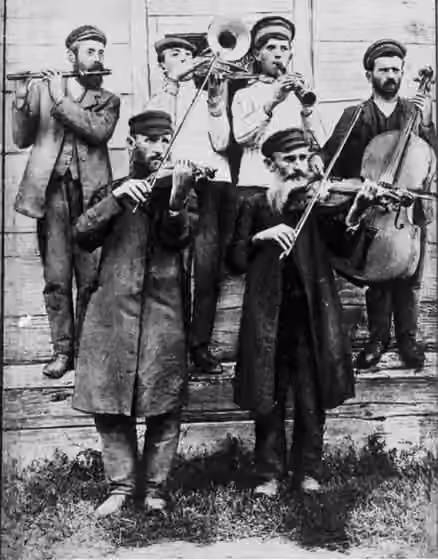 klezmer — Klezmer musicians at a wedding, playing an accompaniment to the arrival of the groom, Ukraine , ca.