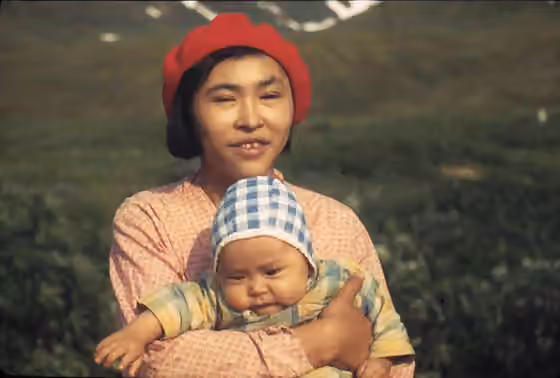 suku Aleut — Aleut woman, perhaps Annie Golodoff Borenin with her son, Victor, Attu, 1941