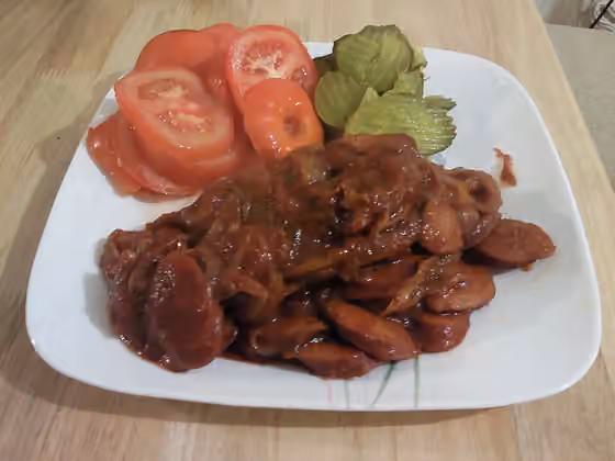 Sosis Bandari — This is a picture from a Persian sausage dish called Port Sausage or Sosis Bandari, made at home, with sliced tomatoes and kosher dills as sides.