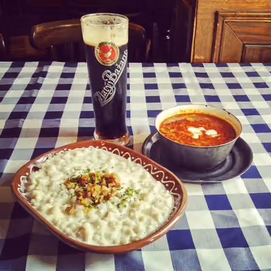 Slovak cuisine — halušky, kapustnica and a dark zlatý bažant beer - example of slovak cuisine