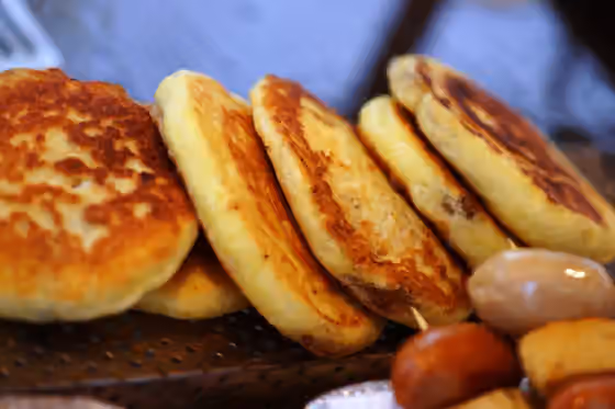 hotteok — Hotteok is a Korean snack made with wheat flour dough filled with dark brown sugar, cinnamon, sesame, and chopped peanuts.
