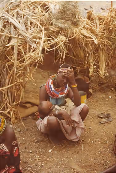 Turkana people — El Molo woman and baby 1979