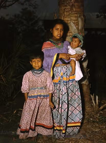Seminole — Local call number: JJS0602 Title: Seminole mother and children: Brighton Reservation, Florida Date: 1949 Physical descrip: 1 transparency - col.