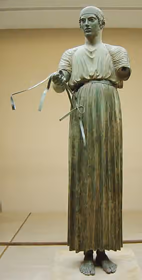 Epinikion — Statue of a charioteer found in Delphi, Greece (front) most probably a chariot driver in the Pythian Games The driver ran for the horses' owner, Polyzalos, tyrant in Sicily between 480-470BC.