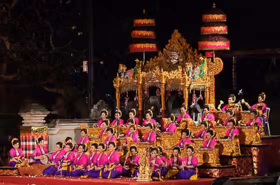 gamelan gong kebyar — Two women's gamelan played on opposite sides of a large open stage while dancers performed.