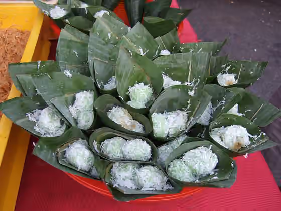 Klepon — Onde-onde filled in grated coconut and gula melaka (a palm sugar).
