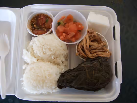 Plate lunch — A plate lunch from the Ward Farmer's Market: ahi poke (raw ahi tuna marinated in shoyu soy sauce, similar to ceviche), lomi lomi salmon , kalua pork and pork lau lau (pork slow cooked in taro leaves) - served with two scoops of rice and…