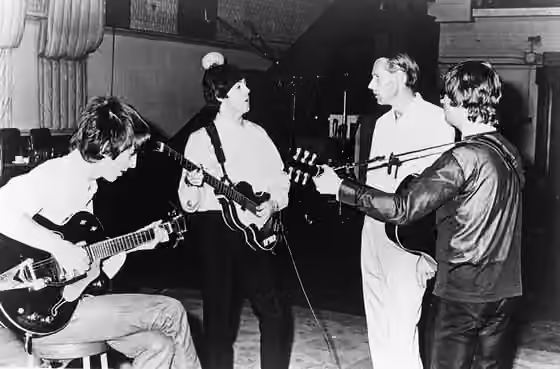 rock eksperimental — Publicity photo of the Beatles with producer George Martin in the studio at Abbey Road .