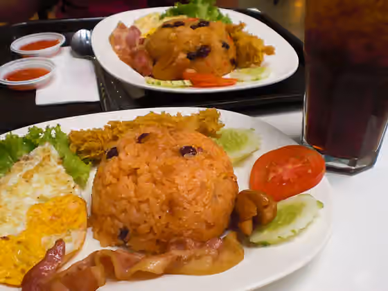 nasi goreng Amerika — American fried rice (rice fried with tomato ketchup and raisins) - as served at MBK center, Bangkok, Thailand