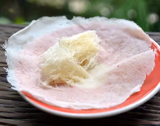Roti sai mai — Roti sai mai (Thai script: โรตีสายไหม): small and thin pancakes used as a wrapper for a kind of candy floss/cotton candy.