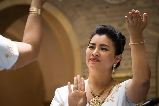 Romvong — Guest performers Sadira Benee and Rita Pin-Ahrens performs the Cambodian dance, " The Dance of Cambodian Women," during the U.S.