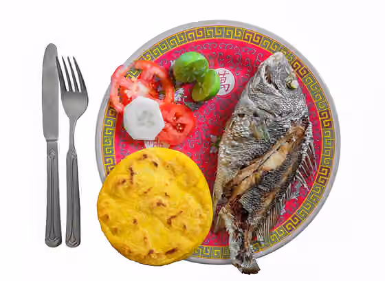 Venezuelan cuisine — Corocoro ( Haemulon plumieri ) with salad of Pepino (Solanum muricatum) , tomatoes and Arepa .