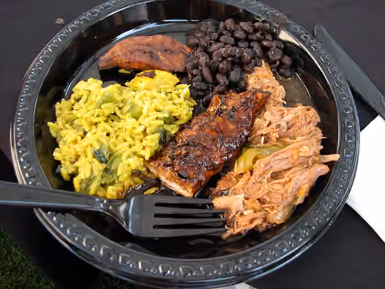 Caribbean cuisine — With privileges come responsibilities, like eating the catered cuban food.