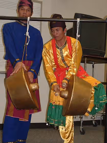 Kulintang — The two Philippine vertically hanged, wide-rimmed gongs known as the [[:en: agung11 |agung11]] used as a supportive/accompanying instrument in the kulintang ensemble , here being used during an agung contest.