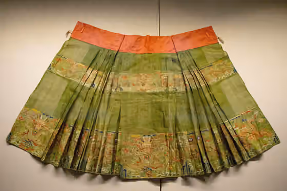 Mamianqun — Ming Dynasty Bright Green Brocaded Gauze Skirt with Gold Woven Floral and Dragon Patterns, Shandong Museum