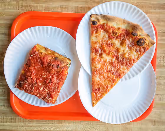 Pizza in New York City — Pizza slices at Paulie Gee's Slice Shop - a "Freddy Prinze" on the left, and plain on the right.