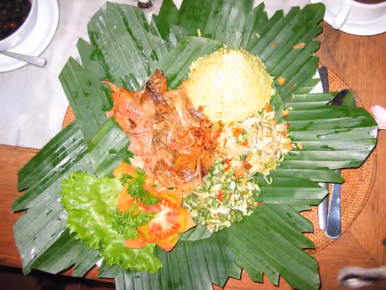 ayam betutu dan bebek betutu — traditional balinese dish-- bebek tutu (smoked duck).
