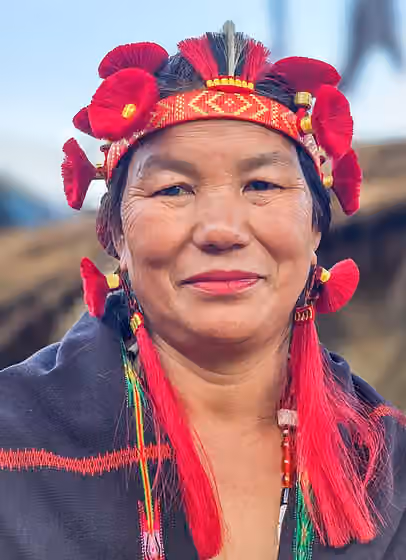 Sema Naga — A Sumi Naga woman adorned in her tribe's stunning headgear, celebrating the vibrant spirit of the Hornbill festival.