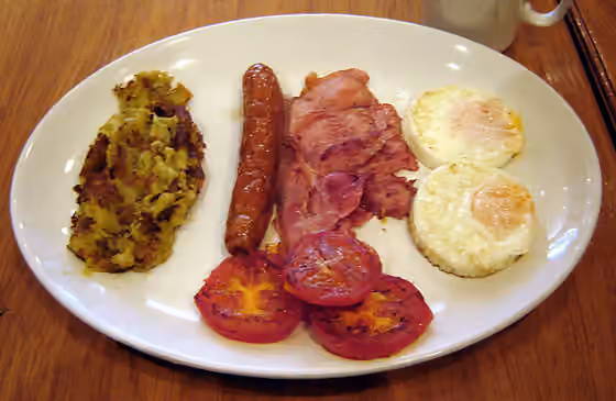 Bubble and squeak — Two eggs, bacon, sausage, tomato and bubble.
