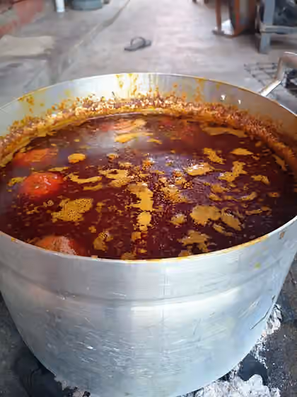 Palm nut soup — Palm nut soup on fire