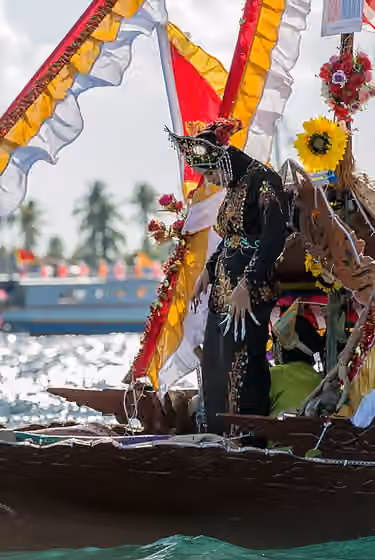 Pangalay — Semporna, Sabah: A Bajau Igal dancer in the bow of a lepa (the traditional Bajau boat) during the Regatta Lepa event 2015.
