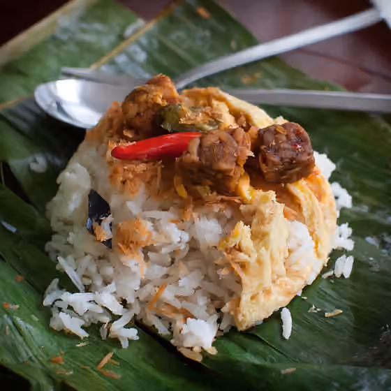 nasi uduk — Indonesian Nasi uduk (rice cooked in coconut milk) is very similar to nasi lemak from Malaysia.