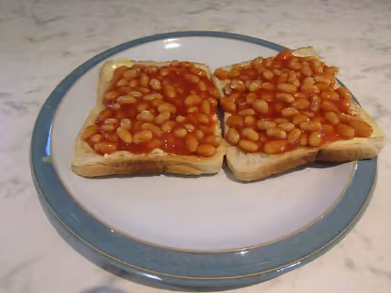 Beans on toast — A dish of Baked beans on toast served in a kitchen in the village of Trimingham , Norfolk, England.