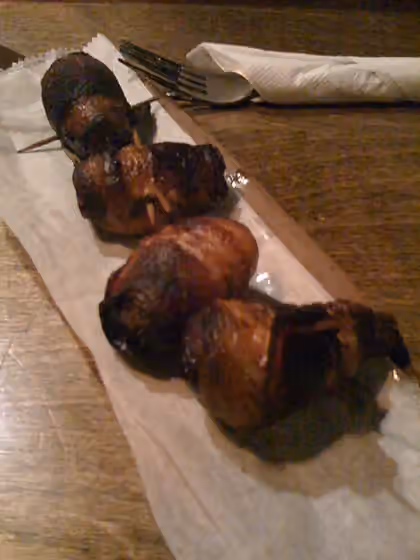 Devils on horseback — Dates stuffed with almonds and wrapped in bacon; sometimes called "devils on horseback"