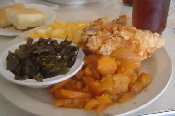 Makanan jiwa — Cornbread, collard greens, macaroni and cheese, fried chicken, yams, and sweet tea.