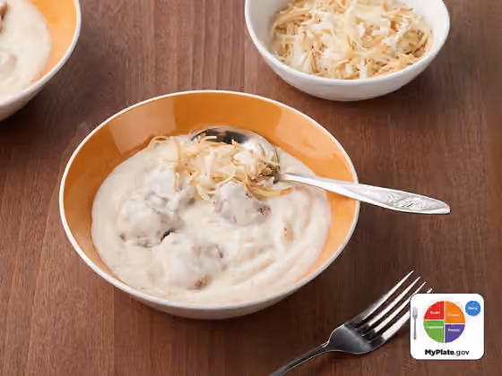 Shakriyeh — Lamb and Yogurt Stew | Shakriyeh, This traditional Middle Eastern dish features a warm yogurt stew with lamb pieces and is served with vermicelli rice.