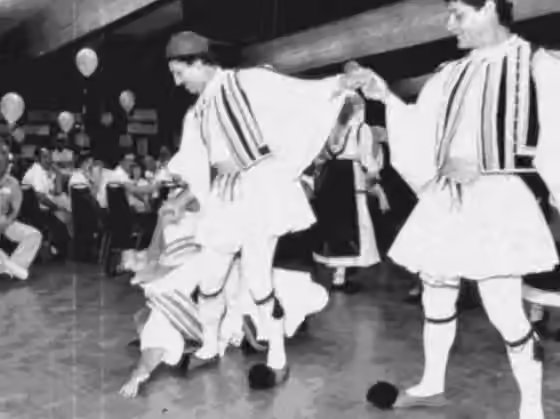 Greek traditional music — Group dancing Tsamiko, in traditional costumes.