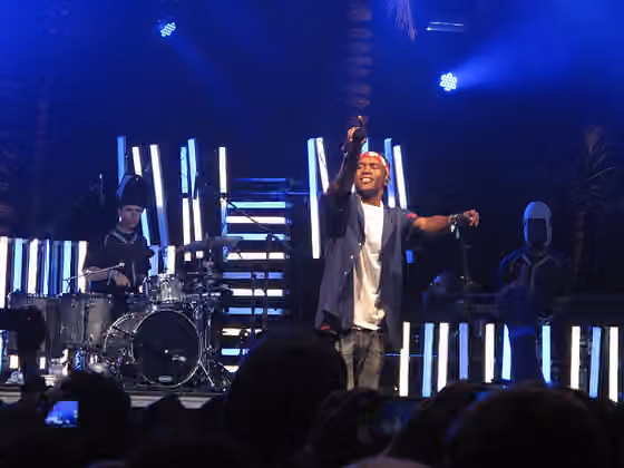Alternative R&B — Frank Ocean holds out his microphone to the crowd while performing at Coachella 2012.