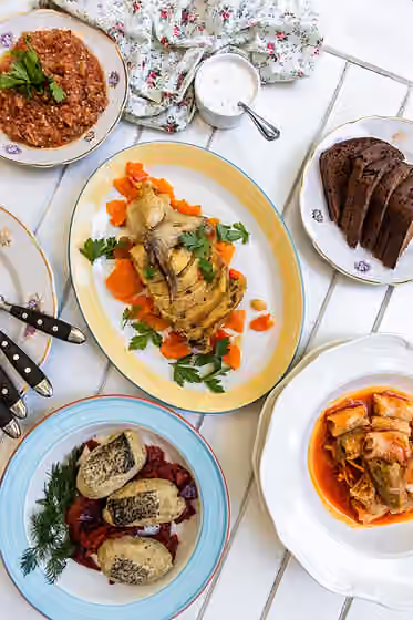 Hidangan Odesa — Cuisine of Odesa dishes: stuffed fish, stuffed chicken neck, aubergine dip, stuffed cabbage rolls "little fingers"