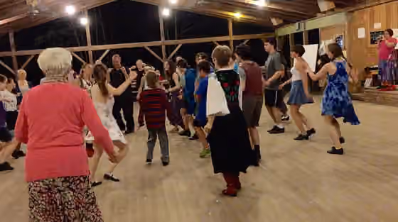 International folk dance — Romanian dance instructors Sonia Dion and Cristian Florescu review a dance in dance pavilion C# during the Folk Arts Center of New England session at w:Pinewoods Camp in 2015.