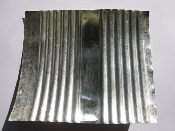 Tinning — The inside of a "tin can" made from steel plated with tin.