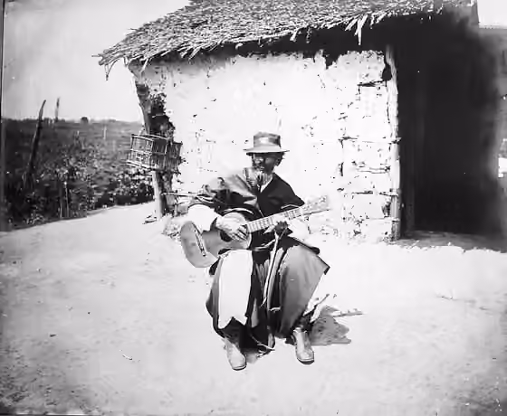 Payada — A "Payador", singing with his guitar in the Argentine Pampas.