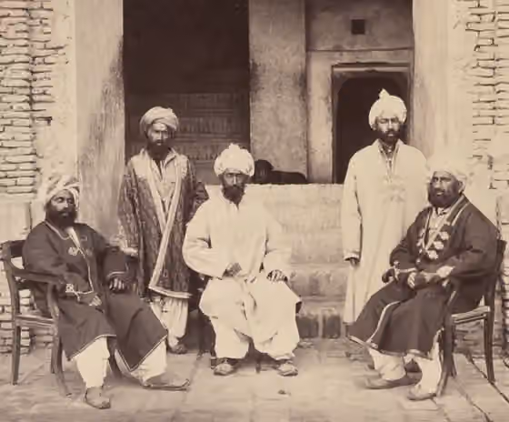 Farsiwan — A five-member group of Parsiwans posing for a photo in the courtyard of a government palace (known then as Wali Sher Ali Khan's Zenana) in Kandahar, Afghanistan.
