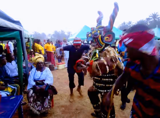 Ogugu — People dancing with the masquerade during the 2018 ofante ogugu cultural carnival
