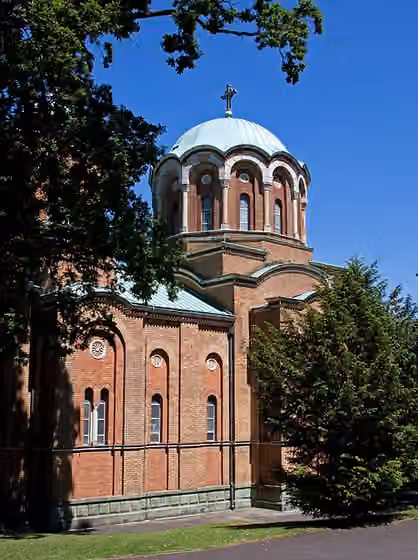Serbs in the United Kingdom — Serbian Orthodox Church of St Lazar built in traditional 14th century Byzantine form by Yugoslavian architect Dr Dragomir Tadic and Bournville Village Trust.