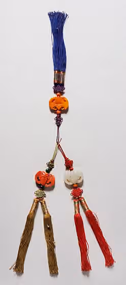 Norigae — Korea, Joseon dynasty (1392-1910), 19th century Jewelry and Adornments Carved amber, coral, and jade with knotted and metal-wrapped threads and silk string Purchased with Museum Funds (M.2000.15.213a-c) Korean Art