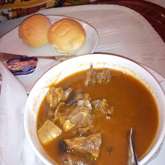 Goat meat pepper soup — goat meat sauce spiced to be eaten with bread or palmwine