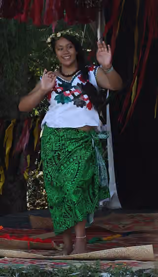 Tuvaluan New Zealanders — A young woman, a proud Tuvaluan girl dances on the Tuvalu stage at the 2011 Pasifika festival, Auckland, New Zealand.