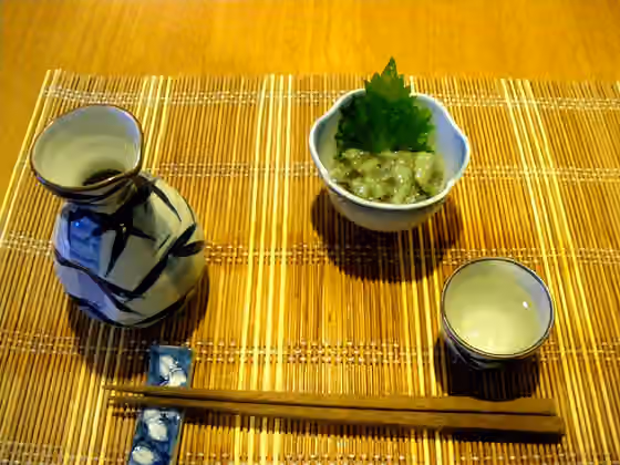Sakana — Japanese sake bottle(tokkuri) and takowasa(octpus with wasabi paste,a side dish of Japanese cuisine.）