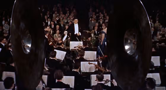 komposisi musik latar — Alfred Hitchcock's "The Man Who Know Too Much" (1956 version) trailer - Bernard Herrmann conducting